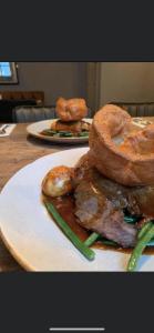 a table with two plates of food on top at The Malthouse in Ironbridge