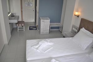 Postel nebo postele na pokoji v ubytování Palm Trees Hotel