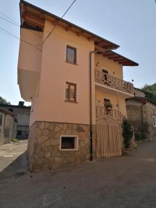 a building with a balcony on the side of it at Casa vacanza la Rosa in Vinadio