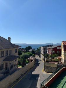 a view of a street in a small town at Sereíña Beach in Vigo