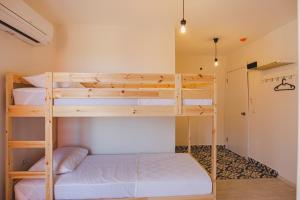 Postel nebo postele na pokoji v ubytování Belsun Hotel