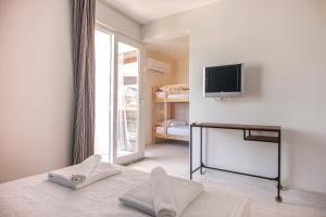 Postel nebo postele na pokoji v ubytování Belsun Hotel