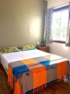Postel nebo postele na pokoji v ubytování Casa de Temporada em Capitólio (Charme e Aconchego)