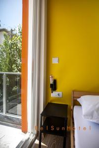 Postel nebo postele na pokoji v ubytování Belsun Hotel