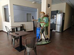 a statue of a man on a snowboard in a room at Senda Sur in Porriño