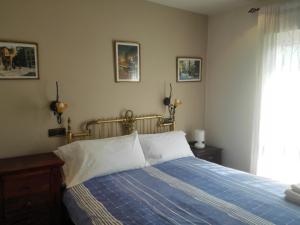En eller flere senge i et værelse på Vivienda Vacacional Villa Betania