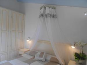 Postel nebo postele na pokoji v ubytování Hotel Tabby