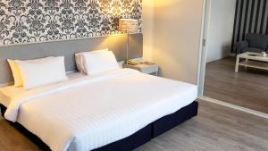 Postel nebo postele na pokoji v ubytování Trang Hotel Bangkok - SHA Plus
