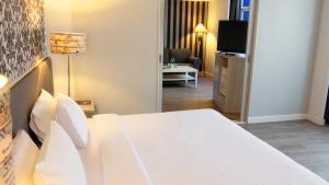 Postel nebo postele na pokoji v ubytování Trang Hotel Bangkok - SHA Plus