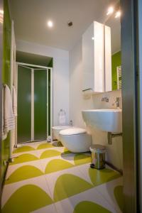 a bathroom with a sink and a tub and a toilet at Le Residenze di Mantova in Mantova