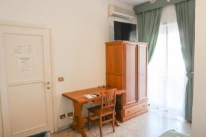 TV a/nebo společenská místnost v ubytování The Condottieri