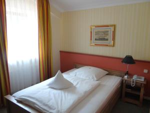 
Ein Bett oder Betten in einem Zimmer der Unterkunft Landhaus Schulze-Hamann
