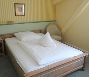
Ein Bett oder Betten in einem Zimmer der Unterkunft Landhaus Schulze-Hamann
