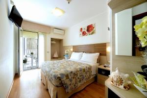 Postel nebo postele na pokoji v ubytování Hotel Colorado