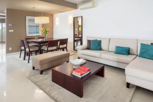 a living room with a couch and a table at Belmar Spa & Beach Resort in Lagos