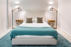 a bedroom with a large bed with two night stands at Belmar Spa & Beach Resort in Lagos