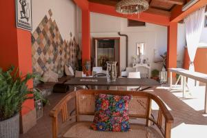 a dining room with a table and a pillow on a chair at Agriturismo Cantina Morone in Guardia Sanframondi