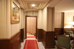 a corridor of a court room with a red carpet at Meserret Palace Hotel - Special Category in Istanbul