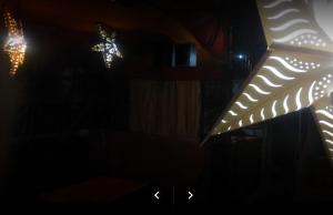 a bunch of lights in a dark room at Shanti Cafe and Guest House Mcloedganj in Dharamshala