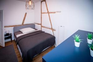 Säng eller sängar i ett rum på Ferienzimmer/Gästezimmer Altstadtzauber
