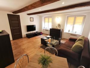 Televízia a/alebo spoločenská miestnosť v ubytovaní Apartament Pod Krzywą Wieżą - zameldowanie 24 h