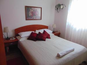Postel nebo postele na pokoji v ubytování Apartments Petra