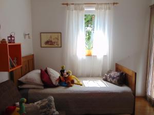 Postel nebo postele na pokoji v ubytování Apartments Petra