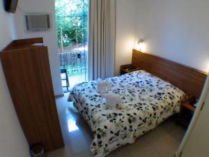 Ein Bett oder Betten in einem Zimmer der Unterkunft Pousada Omnimare