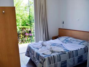 Ein Bett oder Betten in einem Zimmer der Unterkunft Pousada Omnimare