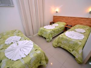 Ein Bett oder Betten in einem Zimmer der Unterkunft Pousada Omnimare