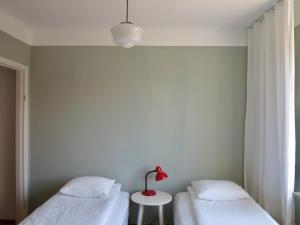 Säng eller sängar i ett rum på HEMMET Simrishamns vandrarhem och B&B