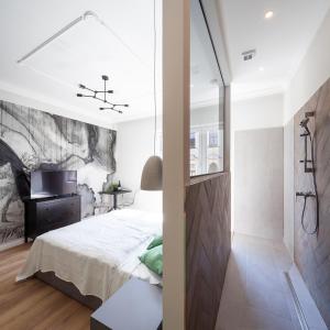 Posteľ alebo postele v izbe v ubytovaní ZACHÁR Apartman