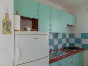 Kuchyň nebo kuchyňský kout v ubytování Apartments Petra