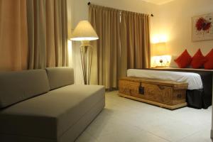 מיטה או מיטות בחדר ב-La Cochinilla Hotel Boutique