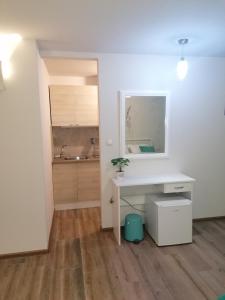 a white desk in a room with a kitchen at Дунав билдингс in Pleven +28 photos