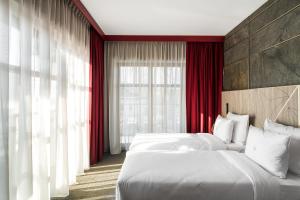 Posteľ alebo postele v izbe v ubytovaní Nosalowy Park Hotel & Spa
