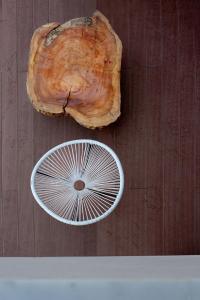 a slice of a tree stump next to a piece of wood at SunBlue Boutique Villas in Skala Rachoniou