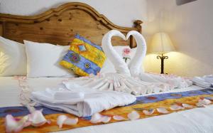 Cama o camas de una habitación en Villas Teotihuacan Hotel & Spa