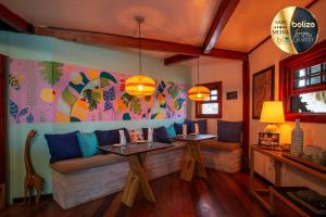 a living room with a couch and two tables at Portofino Beach Resort-An Authentic Island Escape! in San Pedro