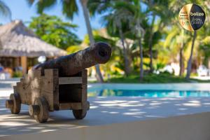 a statue of a cannon riding in a wooden truck at Portofino Beach Resort-An Authentic Island Escape! in San Pedro