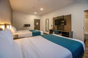 En eller flere senge i et værelse på Motel 6 North Platte - East
