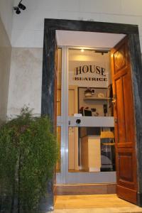 a door to a house kleinablishment in a building at House Beatrice Milano in Milan