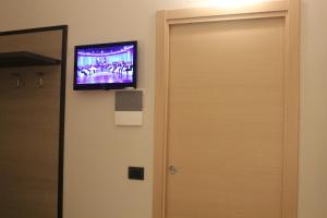 TV a/nebo společenská místnost v ubytování House Beatrice Milano + 20 fotografií