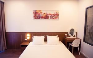 Postel nebo postele na pokoji v ubytování Marina Hotel Phú Yên
