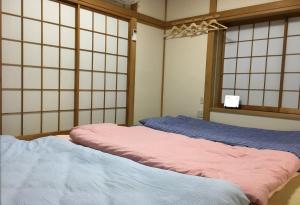 Rúm í herbergi á Yokohama - House - Vacation STAY 9002