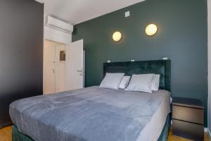 a bedroom with a large bed with two white pillows at Dea2 in Mali Lošinj