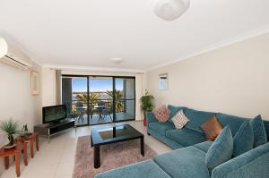 a living room filled with furniture and a couch at Sandcastles On The Broadwater in Gold Coast