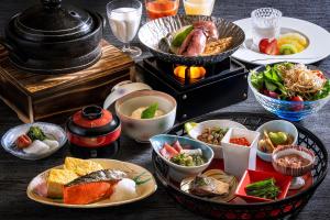 a table with plates of food and bowls of food at Bourou Noguchi Hakodate in Hakodate