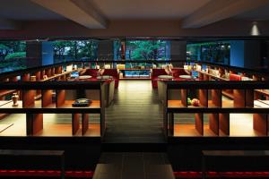 a view of a library with tables and chairs at Bourou Noguchi Hakodate in Hakodate