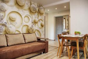 a living room with a couch and a table at Мій дім in Chernihiv +94 photos